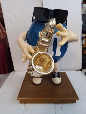 m & m collectibles Blue Playing Saxophone figure dispenser